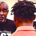 Herbert Dennard talking to an inmate.