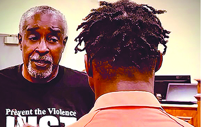 Herbert Dennard talking to an inmate.